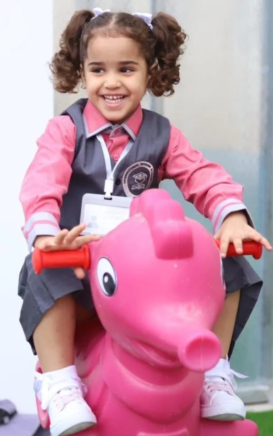 Kindergarten pupil playing outdoors