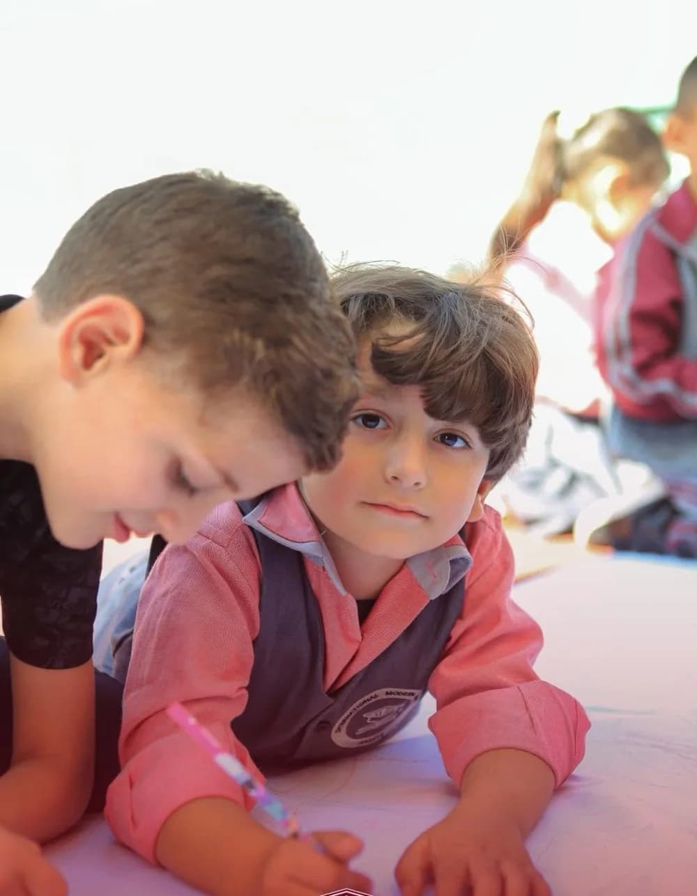 Young learners drawing together